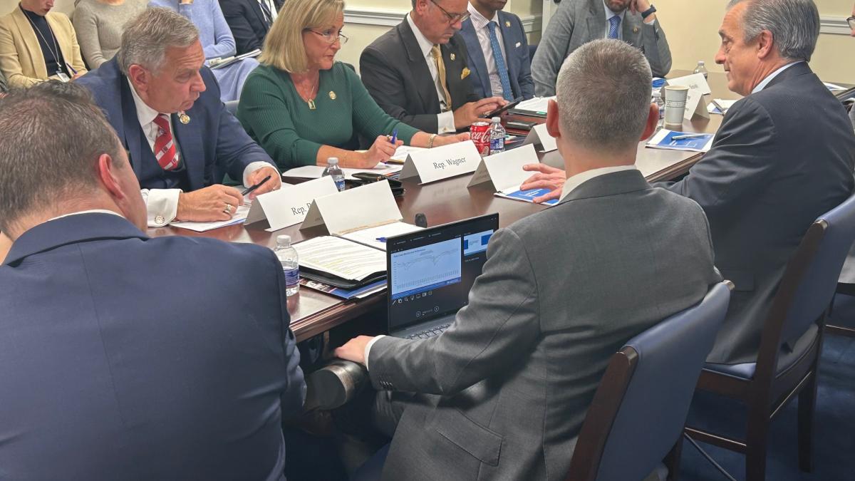 Postmaster General Meeting at a Table