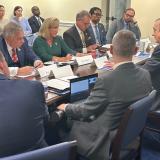 Postmaster General Meeting at a Table